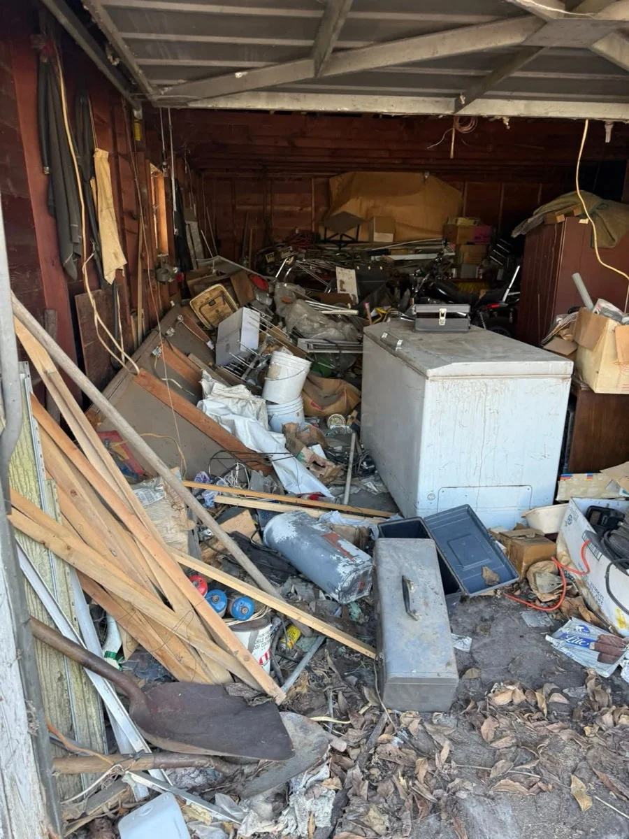 Cluttered garage before Kent's cleanout