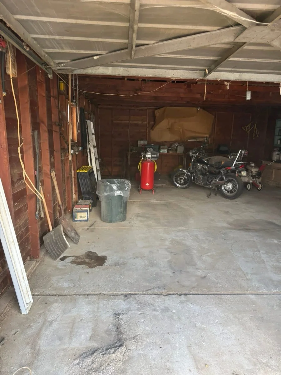 Garage with floor space cleared after cleanout